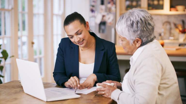 Older woman with estate planning attorney