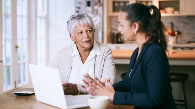 Woman sitting with estate planning attorney