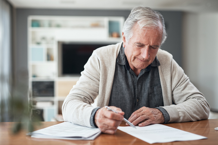 Older man working on his estate plan